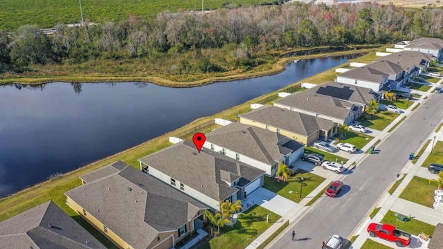 bird's eye view with a water view