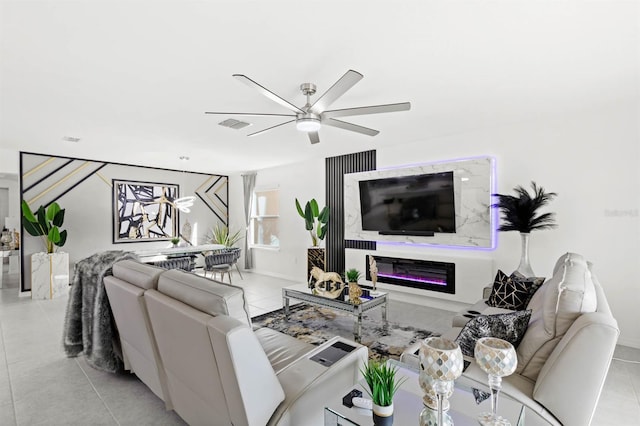 tiled living room featuring ceiling fan