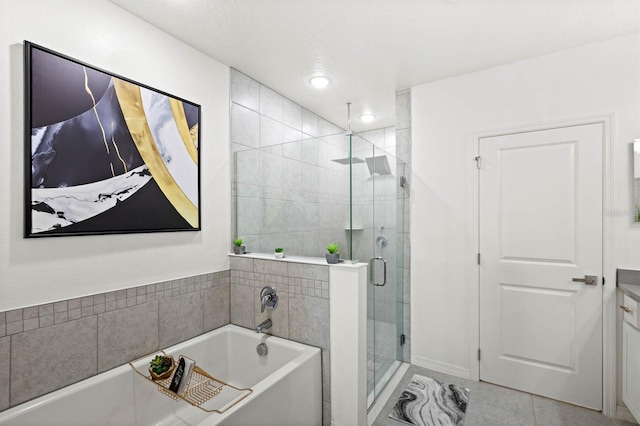 bathroom featuring vanity, shower with separate bathtub, and tile patterned flooring