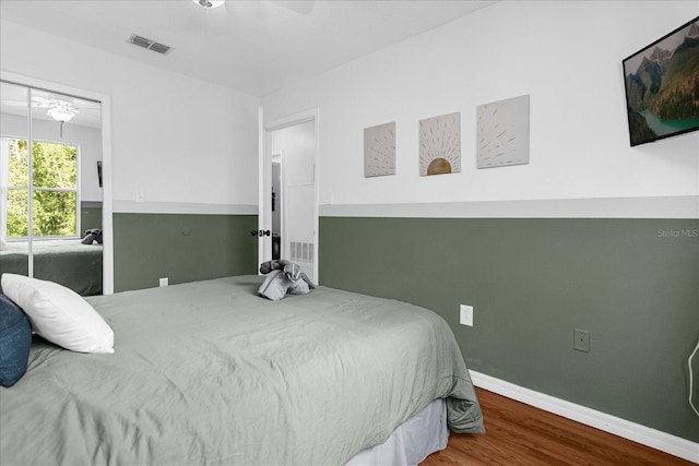 bedroom featuring wood-type flooring and ceiling fan