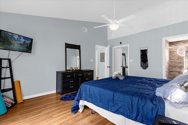 bedroom with wood-type flooring, high vaulted ceiling, and ceiling fan