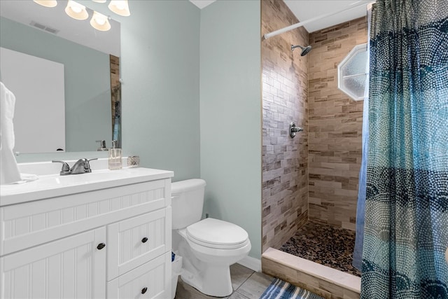 bathroom featuring vanity, tile patterned floors, toilet, and a shower with shower curtain