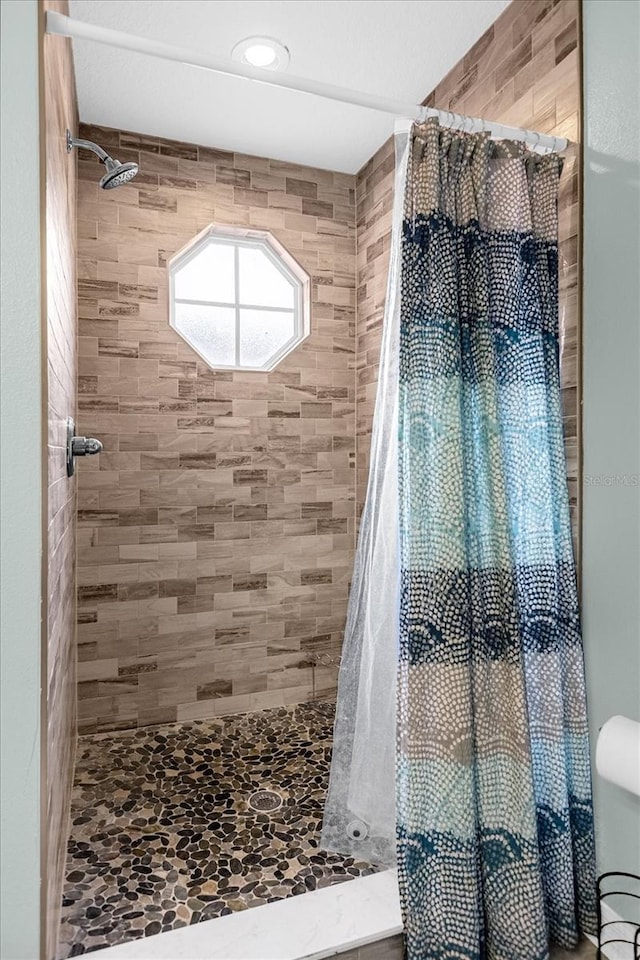 bathroom featuring a shower with curtain