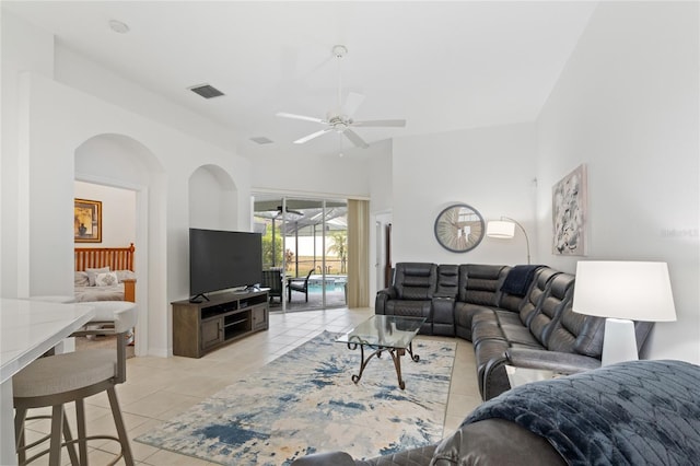 living room featuring ceiling fan and light tile patterned flooring