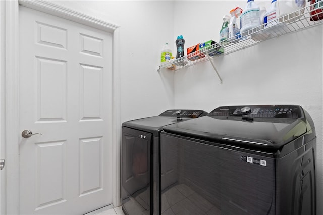 washroom featuring washer and clothes dryer