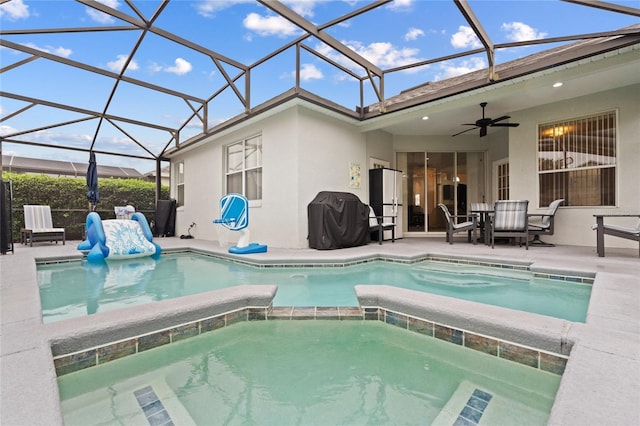 view of pool with a patio area, grilling area, a lanai, an in ground hot tub, and ceiling fan