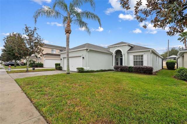 view of front facade featuring a garage and a front yard