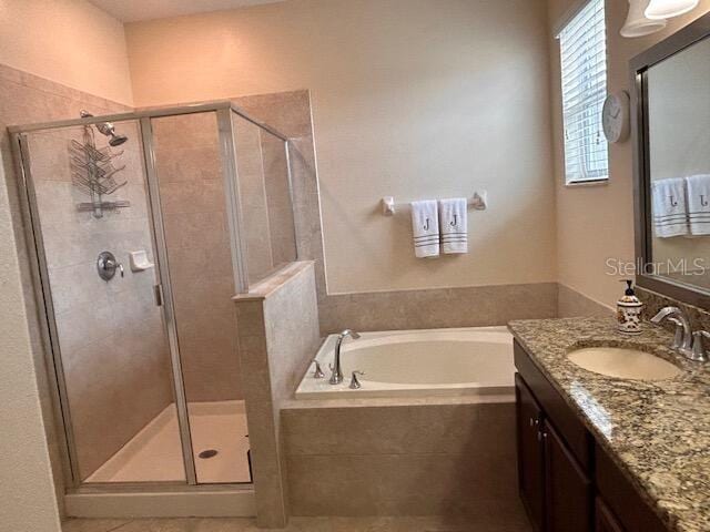 bathroom featuring vanity and plus walk in shower