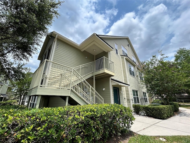 view of home's exterior with stairway