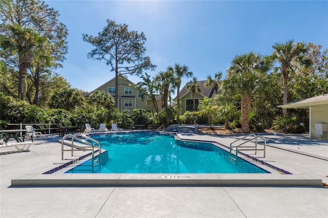 pool featuring a patio area