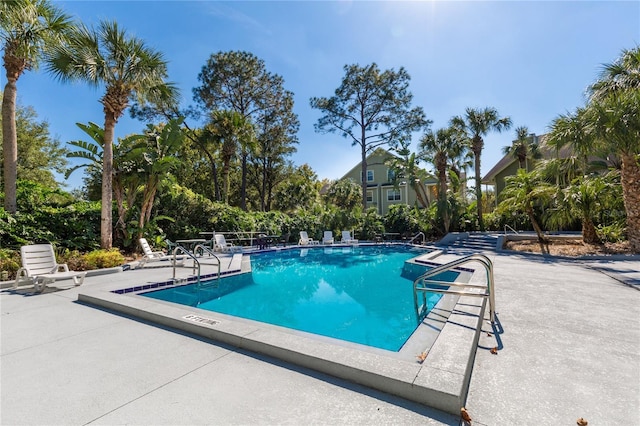 community pool featuring a patio area