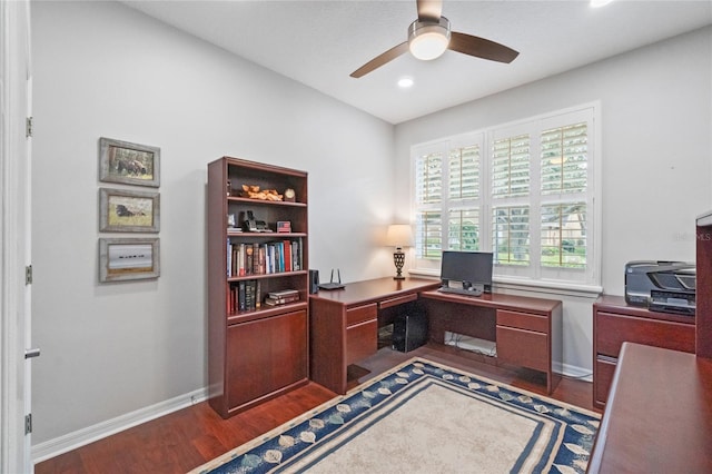 office area featuring dark hardwood / wood-style floors and ceiling fan