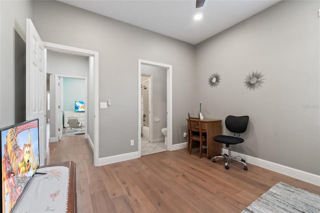 office with ceiling fan and light wood-type flooring