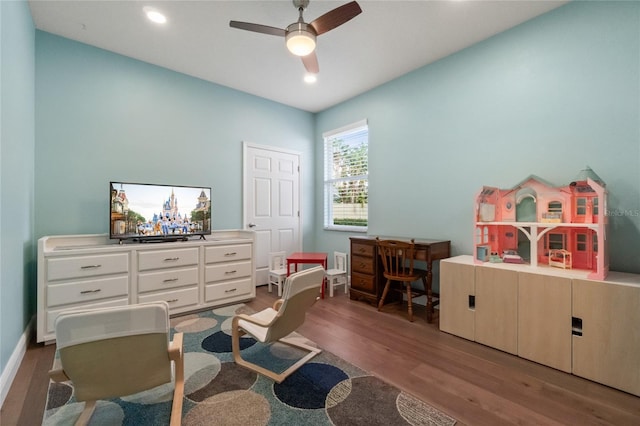 interior space featuring hardwood / wood-style floors and ceiling fan