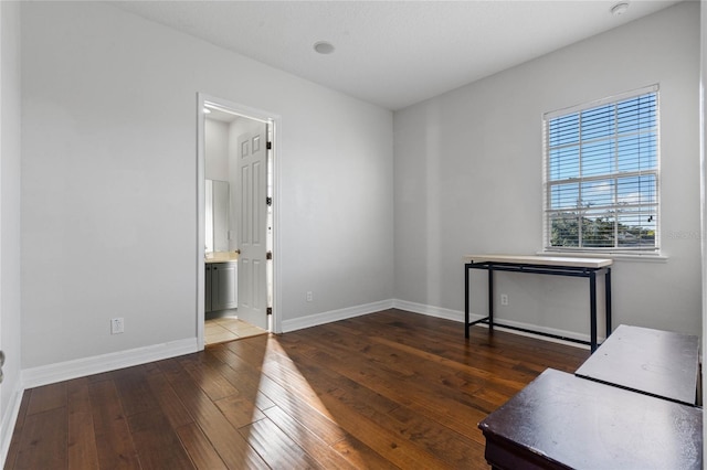 empty room featuring dark wood-type flooring