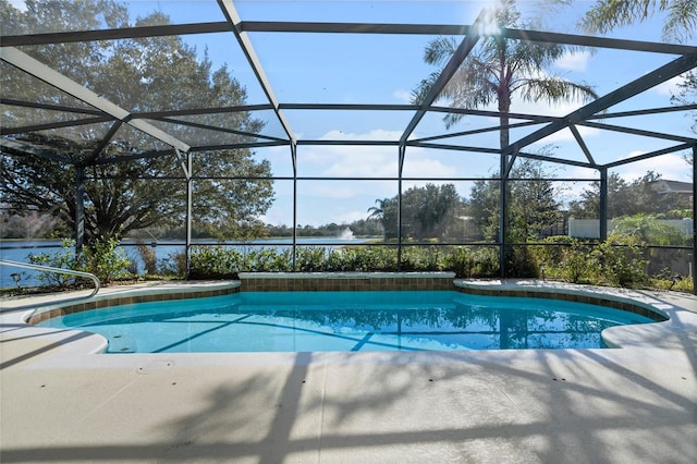 view of swimming pool featuring a patio and glass enclosure