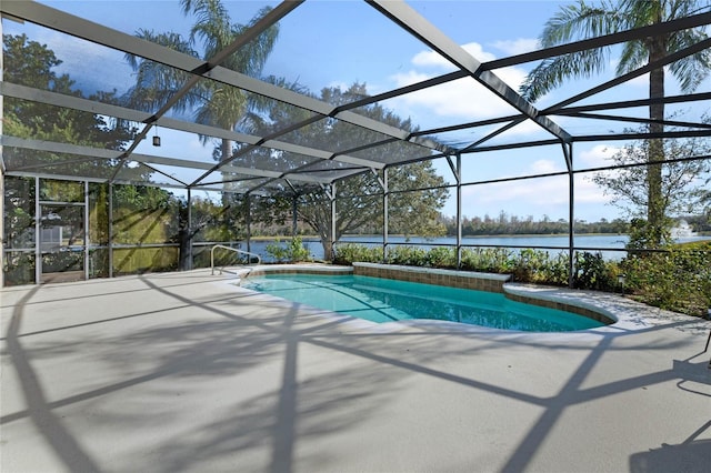 view of pool with a patio, a water view, and glass enclosure