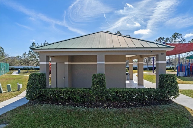 view of side of home featuring a lawn