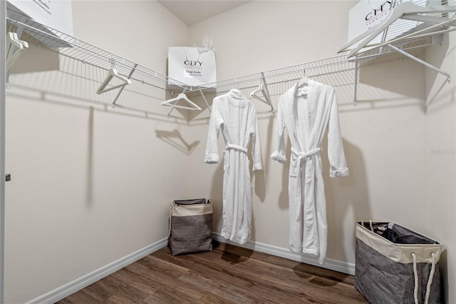 walk in closet featuring dark hardwood / wood-style flooring