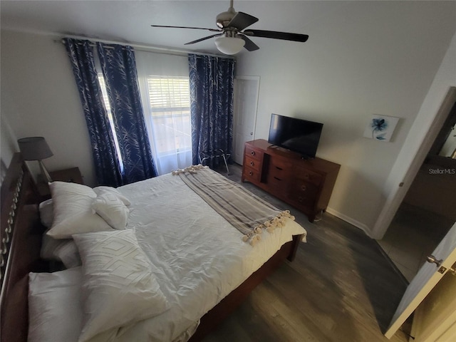 bedroom featuring dark hardwood / wood-style flooring and ceiling fan