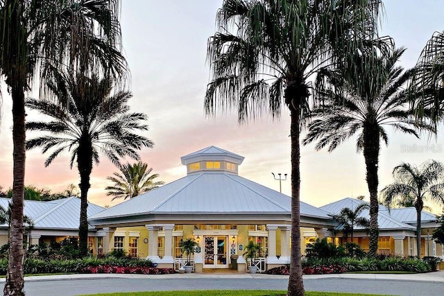 view of outdoor building at dusk