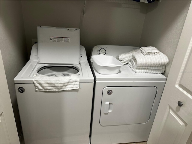 laundry room featuring independent washer and dryer