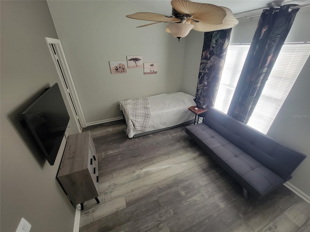 bedroom with hardwood / wood-style flooring and ceiling fan