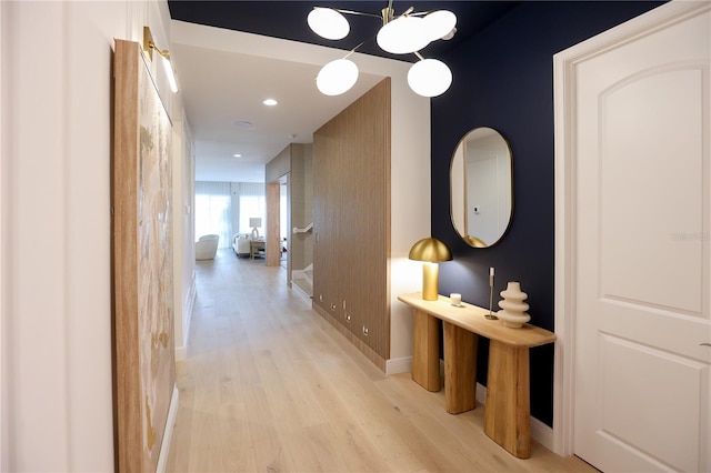 hallway with light hardwood / wood-style flooring