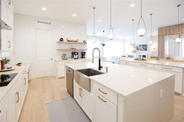 kitchen with sink, white cabinets, a center island with sink, decorative light fixtures, and stainless steel dishwasher