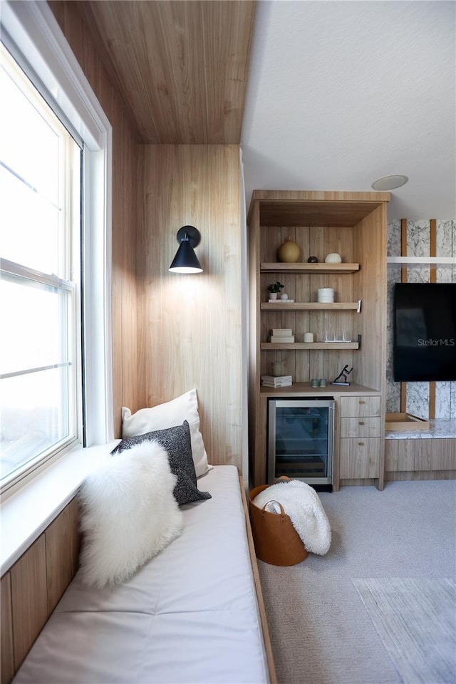 bedroom featuring wood ceiling and carpet