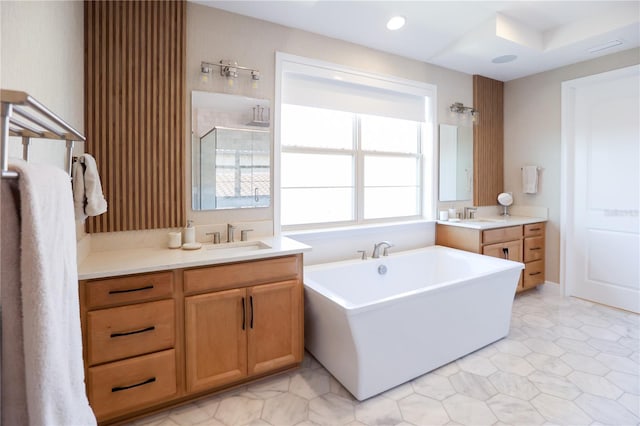 bathroom featuring vanity and plus walk in shower