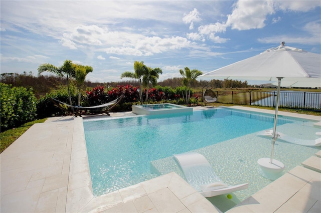 view of swimming pool featuring an in ground hot tub