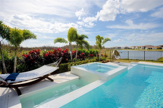 view of pool featuring an in ground hot tub