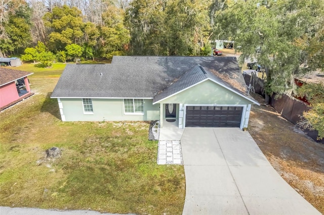 view of front facade with a garage and a front yard