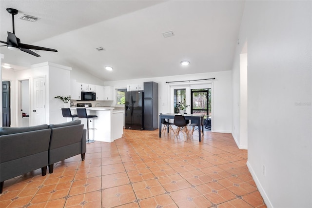 kitchen featuring light tile patterned flooring, black appliances, high vaulted ceiling, ceiling fan, and white cabinets