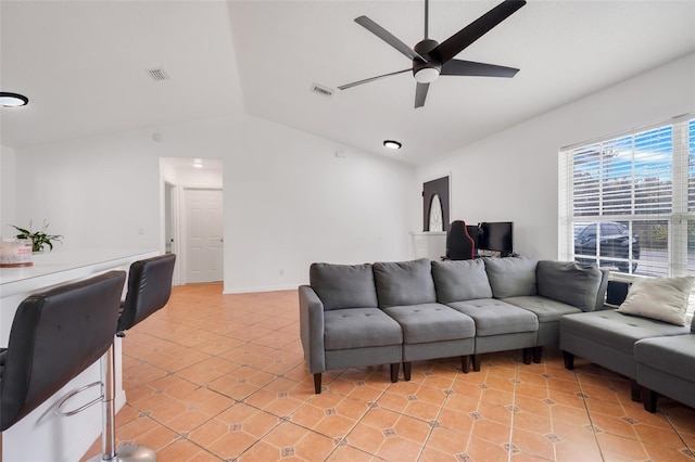 tiled living room featuring vaulted ceiling and ceiling fan