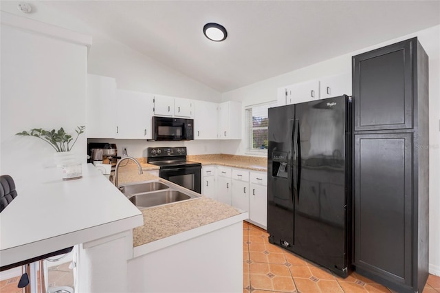 kitchen featuring lofted ceiling, sink, black appliances, white cabinets, and kitchen peninsula