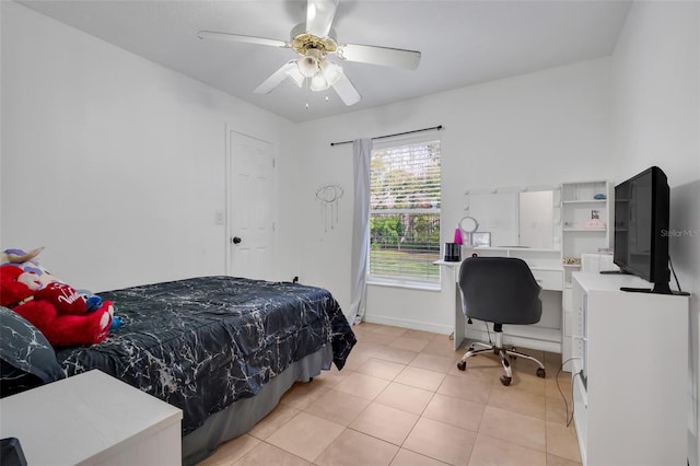 tiled bedroom featuring ceiling fan