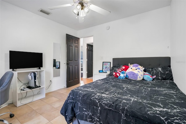 tiled bedroom with ceiling fan