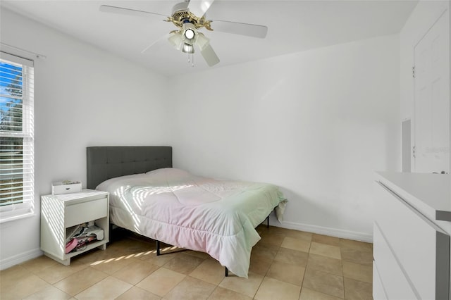 bedroom featuring light tile patterned floors and ceiling fan