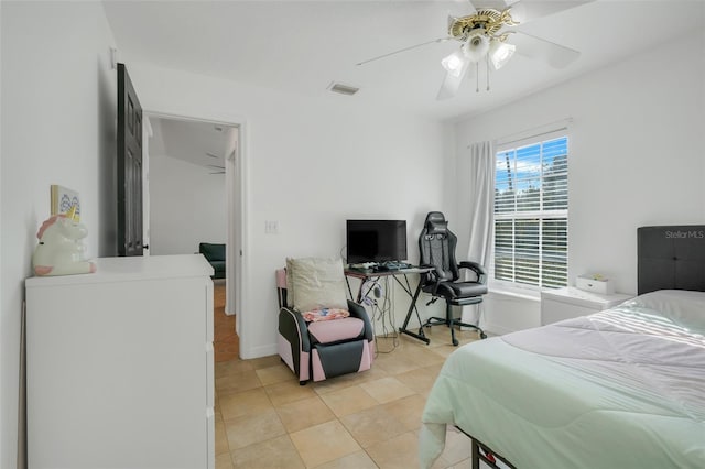 tiled bedroom with ceiling fan