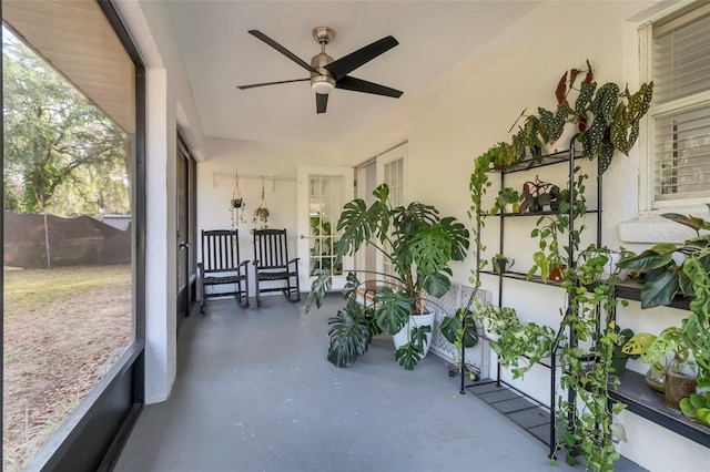 sunroom / solarium with ceiling fan