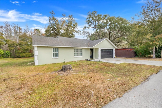 ranch-style house with a garage and a front yard