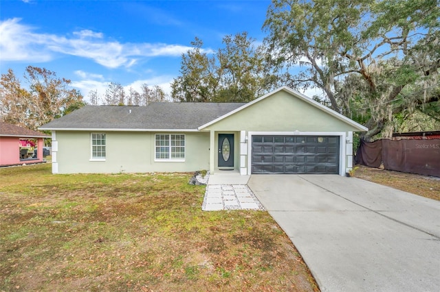 single story home with a garage and a front yard