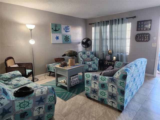 tiled living room featuring a textured ceiling