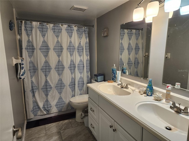 bathroom with tile patterned flooring, vanity, a shower with curtain, and toilet