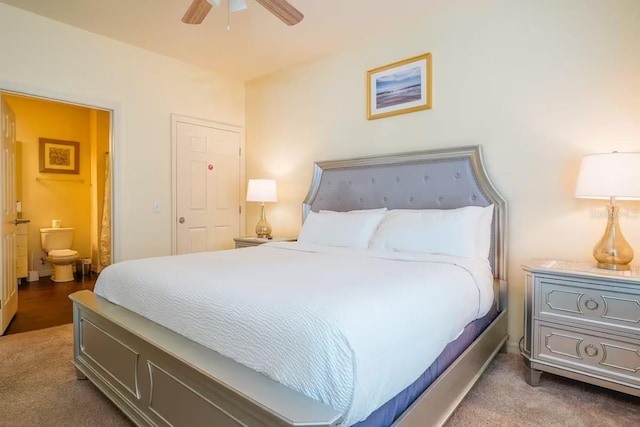 carpeted bedroom with ceiling fan and connected bathroom