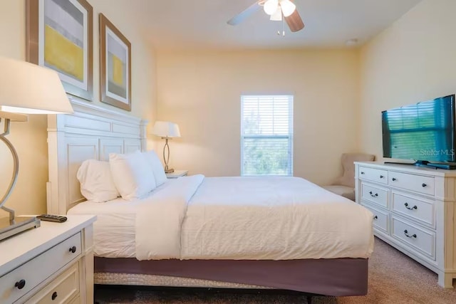 bedroom with ceiling fan and carpet