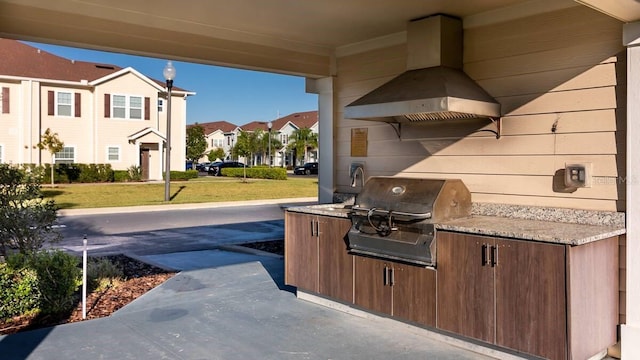 view of patio with an outdoor kitchen and grilling area