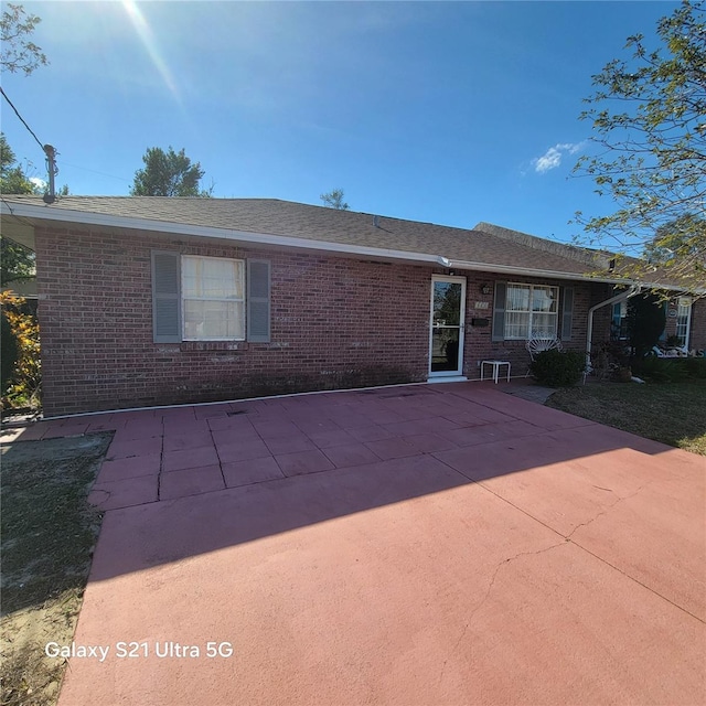 rear view of property with a patio area